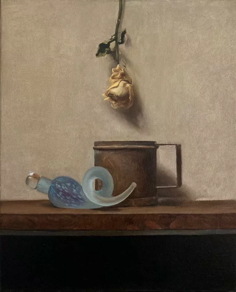 Still life painting. Dried yellow rose hanging above a tin cup with an artisan blue glass perfume bottle lying in front.
